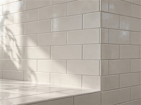 Illustration of glazed ceramic tiles around a wall corner and ledge.